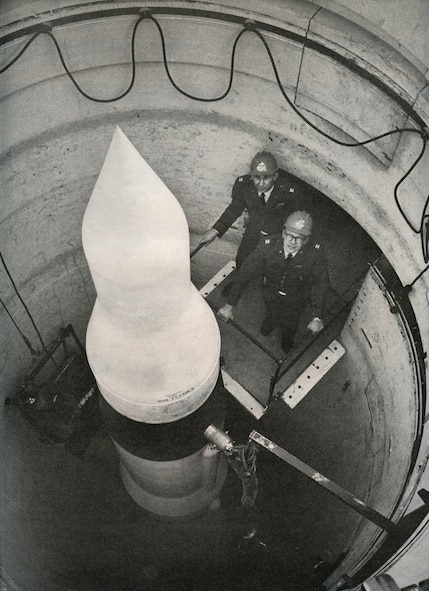 MISSILE COMPLEX, S.D. -- Captains Allen Lamb and Bill Christians, missile combat crew commanders, stand on a platform at a missile silo, November 1964. This year marks the 50th Anniversary of the installation of the first Minuteman Intercontinental Ballistic Missile. As these photos show, the mission has existed for decades and will continue to provide safe, secure and effective strategic deterrence for years to come. (LIFE photo/Bill Ray)