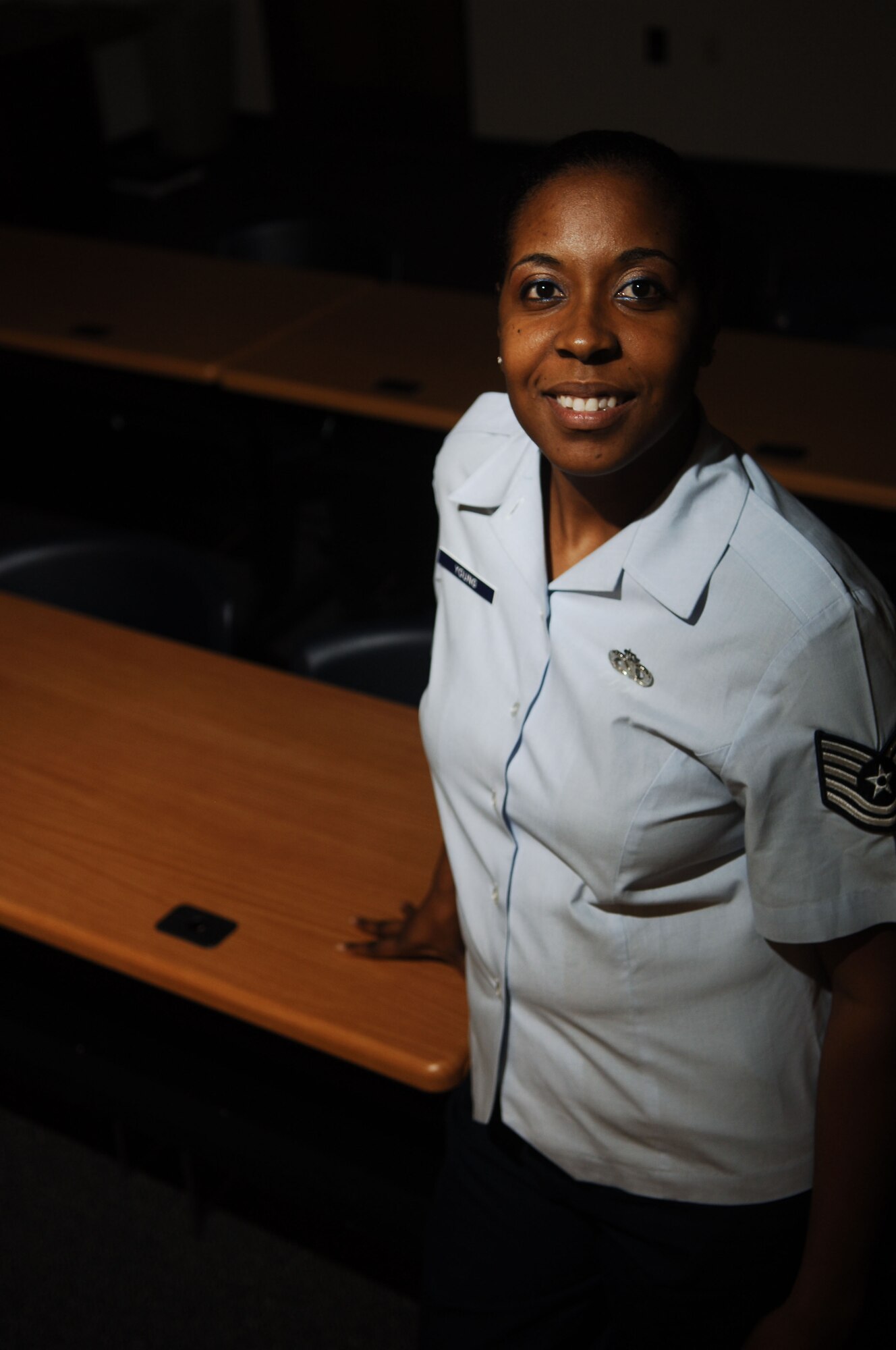 Tech Sgt. Kimberly Young, 633rd Air Base Wing Safety noncommissioned officer in charge, poses for a photo at Langley Air Force Base, Va., Nov. 19, 2012.  Although Young has won numerous awards after being in safety just three years, she says the recognition is not a factor in why she loves teaching defensive driving. (U.S. Air Force photo by Staff Sgt. Katie Gar Ward / Released)