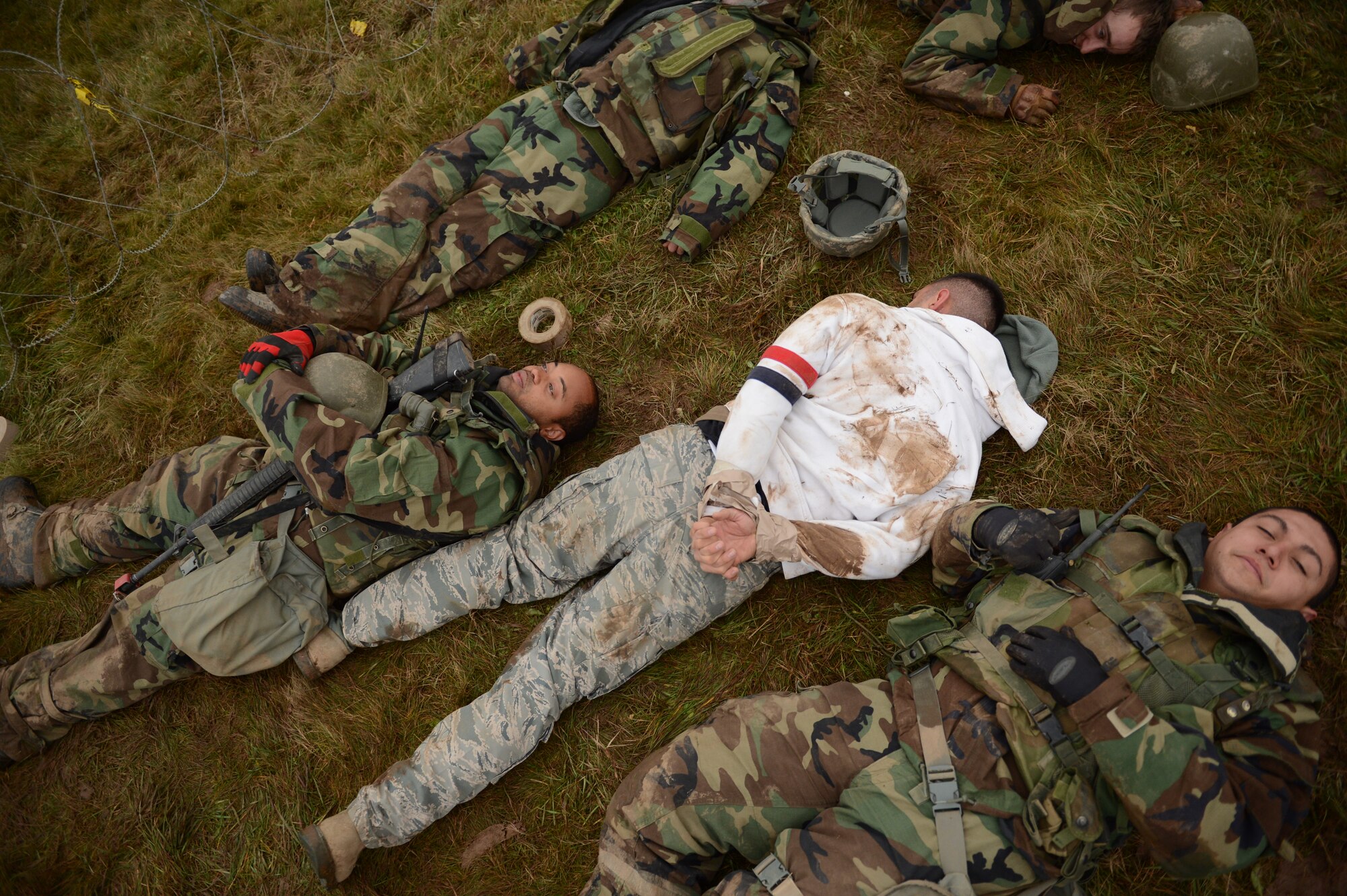 SPANGDAHLEM AIR BASE, Germany – Casualties from a simulated detonated improvised explosive device lay on the ground inside the perimeter of the 606th Air Control Squadron’s base during combat readiness training Nov. 15, 2012. During the training instructors try to overwhelm the 606th Airmen with worst-case scenarios, which helps prepare them for real-world operations. (U.S. Air Force photo by Staff Sgt. Nathanael Callon/Released)