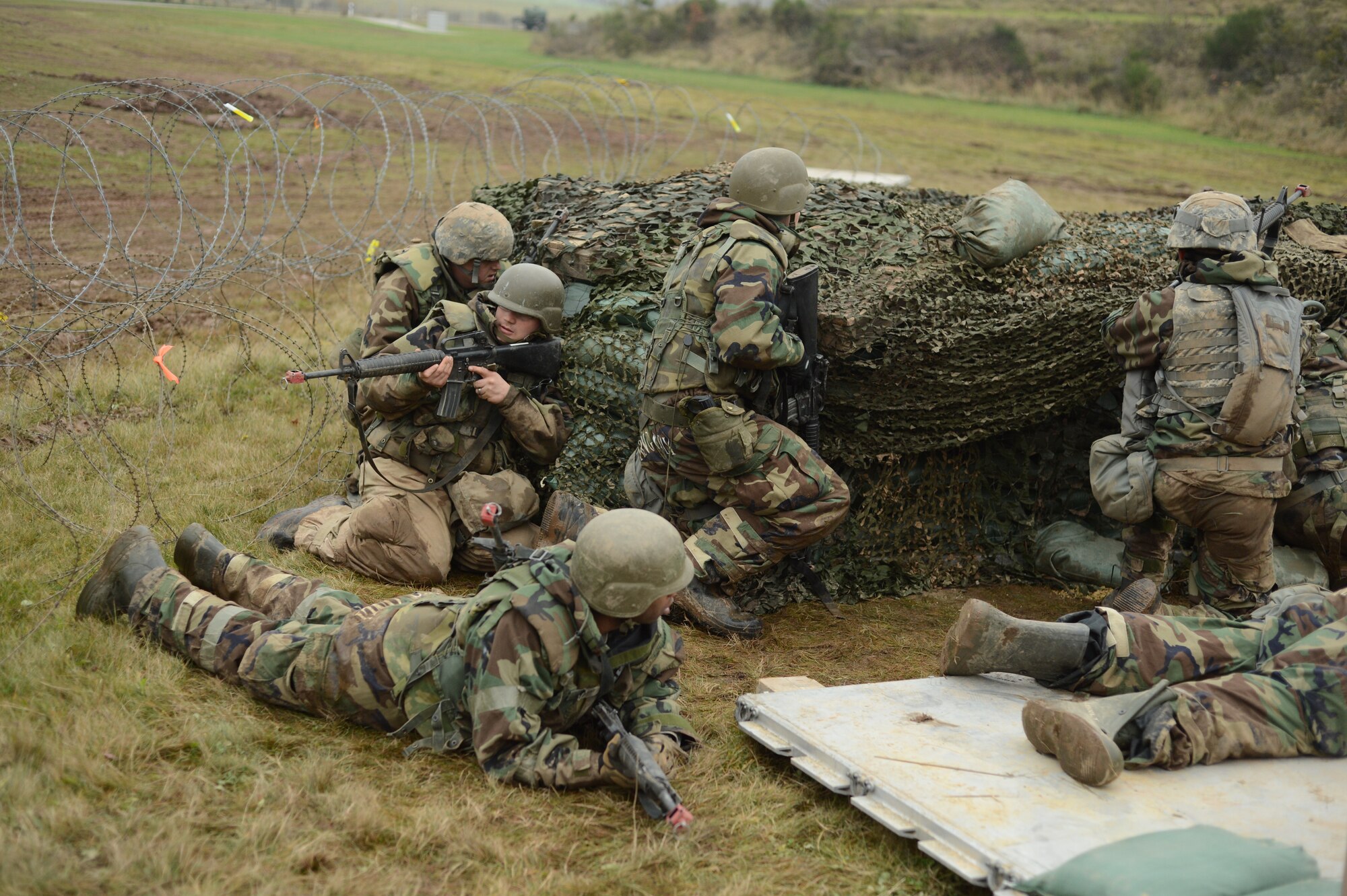 SPANGDAHLEM AIR BASE, Germany – Airmen from the 606th Air Control Squadron take cover from gunfire during combat readiness training Nov. 15, 2012. The 606th is a rapidly-deployable combat unit that can convoy to remote locations and control allied air assets during contingency operations. (U.S. Air Force photo by Staff Sgt. Nathanael Callon/Released)