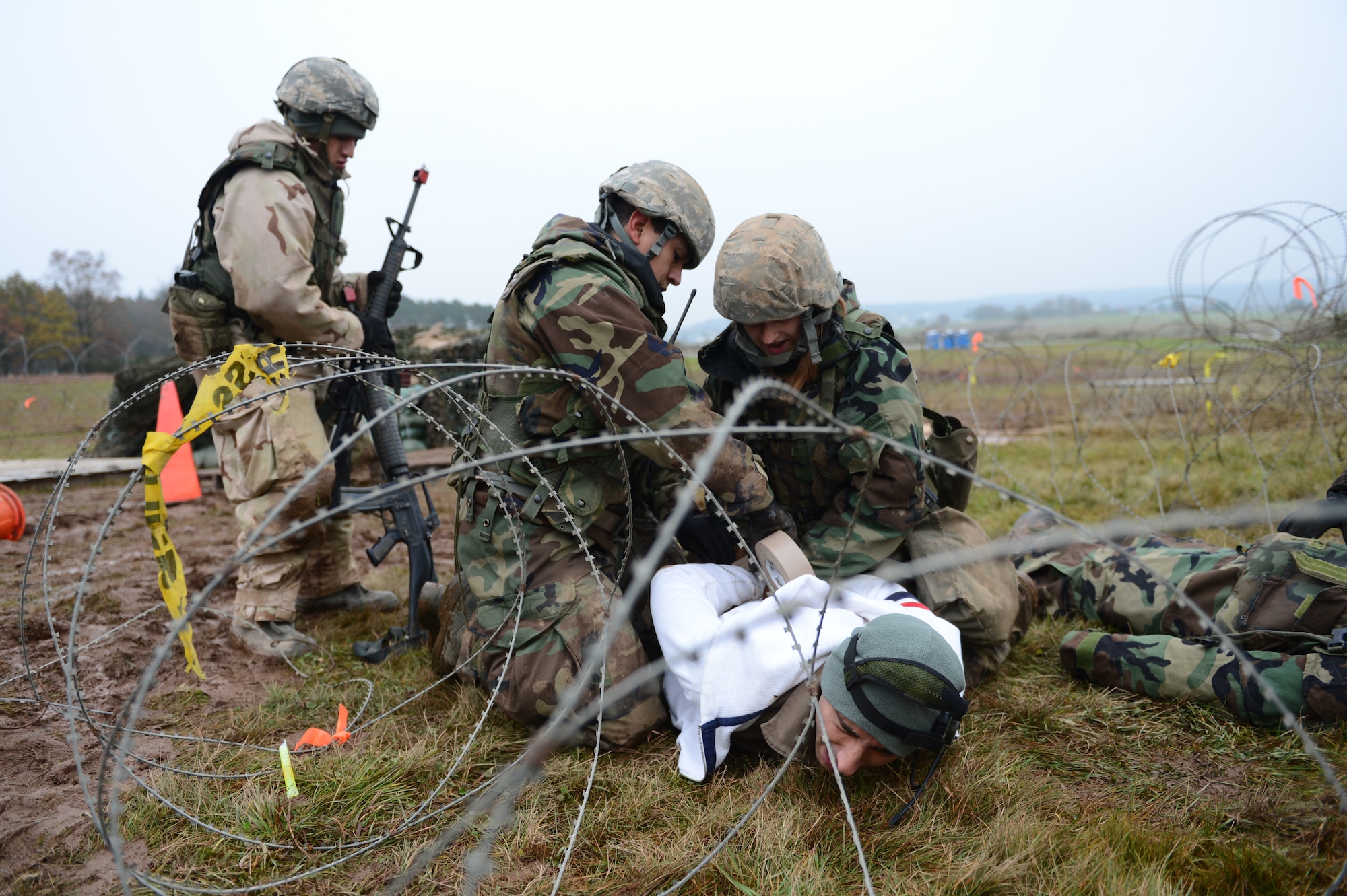 SPANGDAHLEM AIR BASE, Germany – Airmen from the 606th Air Control Squadron search a suspect for weapons and communications equipment during combat readiness training Nov. 15, 2012. The three-week combat readiness training consists of classroom training and a 72-hour field operations exercise that test the Airmen mentally and physically to ensure they are capable of deploying. (U.S. Air Force photo by Airman 1st Class Dillon Davis/Released)