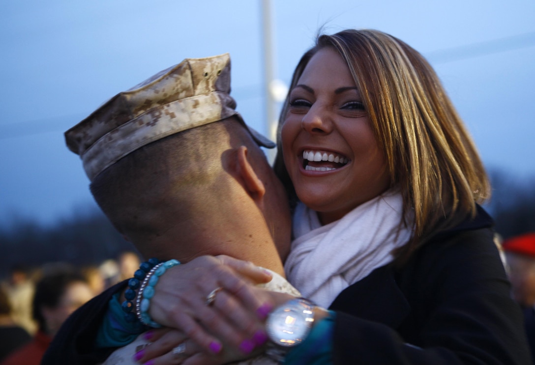 Janna Schickel, wife of Staff Sgt. Matt Schickel, a platoon guide from Company E, 4th Tank Battalion, 4th Marine Division, welcomes her husband home Nov. 15, 2012, at Fort Knox, Ky., upon his return from a six-month deployment to Afghanistan.  The Lanesville, Ind., native was greeted by friends and family upon his arrival at Fort Knox. (U.S. Marine Corps Photo by Cpl. Nana Dannsa-Appiah/Released)