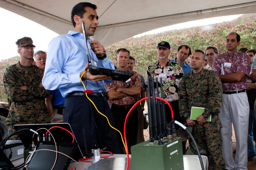 Babak Daneshrad, from the University of California, Los Angeles, introduces Radio Frequency Technologies to top infantry leaders from 3rd Marine Regiment, representatives from the Marine Corps Warfighting Laboratory and others during Agile Bloodhound 2012 here Nov. 16. Agile Bloodhound is an integration and demonstration event that was conducted in order to highlight research and development efforts and associated technologies that support Marine expeditionary war fighters.
