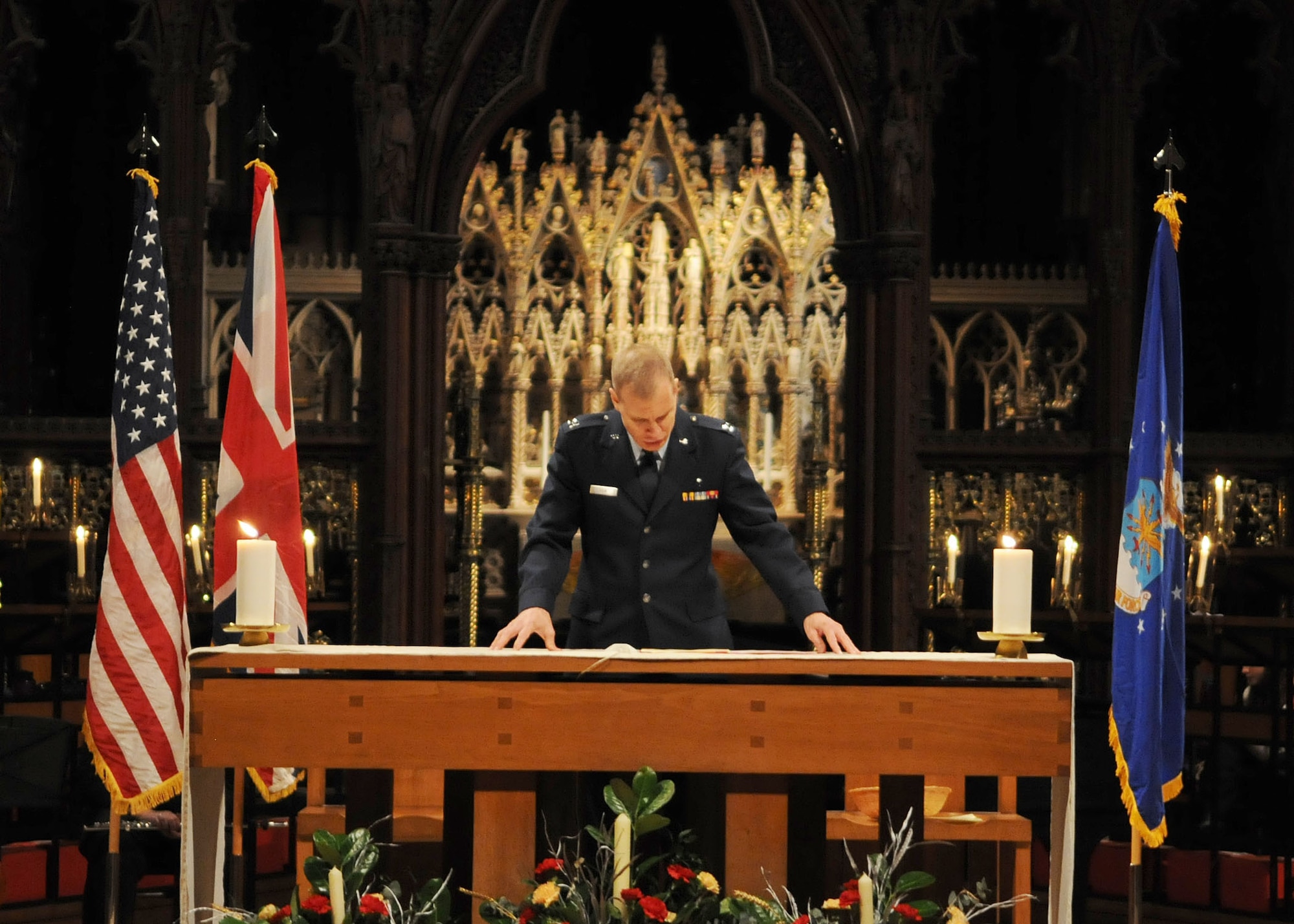 ELY, England – Chaplain (Capt.) Phillip Kiam, RAF Mildenhall chaplain, gives the final blessing during the Thanksgiving service Nov. 21, 2012, at Ely Cathedral. The cathedral was built by William the Conqueror as a prominent outpost after the bloody and lengthy rebellion by Hereward the Wake. (U.S. Air Force photo by Staff Sgt. Tabitha M. Lee/Released)
