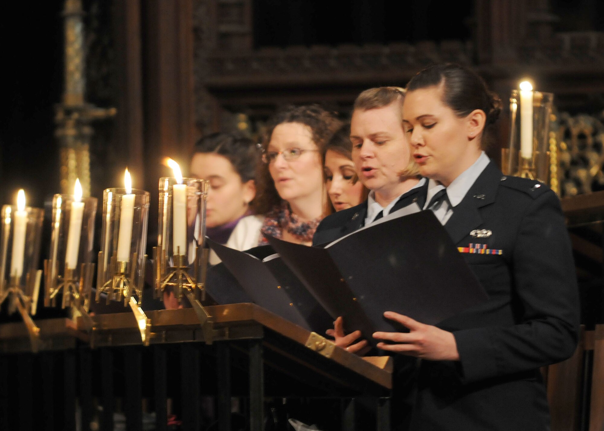 ELY, England – The RAF Mildenhall and RAF Lakenheath combined choir sings during a service on the eve of Thanksgiving Nov. 21, 2012, at Ely Cathedral. This service of thanks is conducted every year for American service members, their families and other employees of RAF Mildenhall and RAF Lakenheath.  (U.S. Air Force photo by Staff Sgt. Tabitha M. Lee/Released)