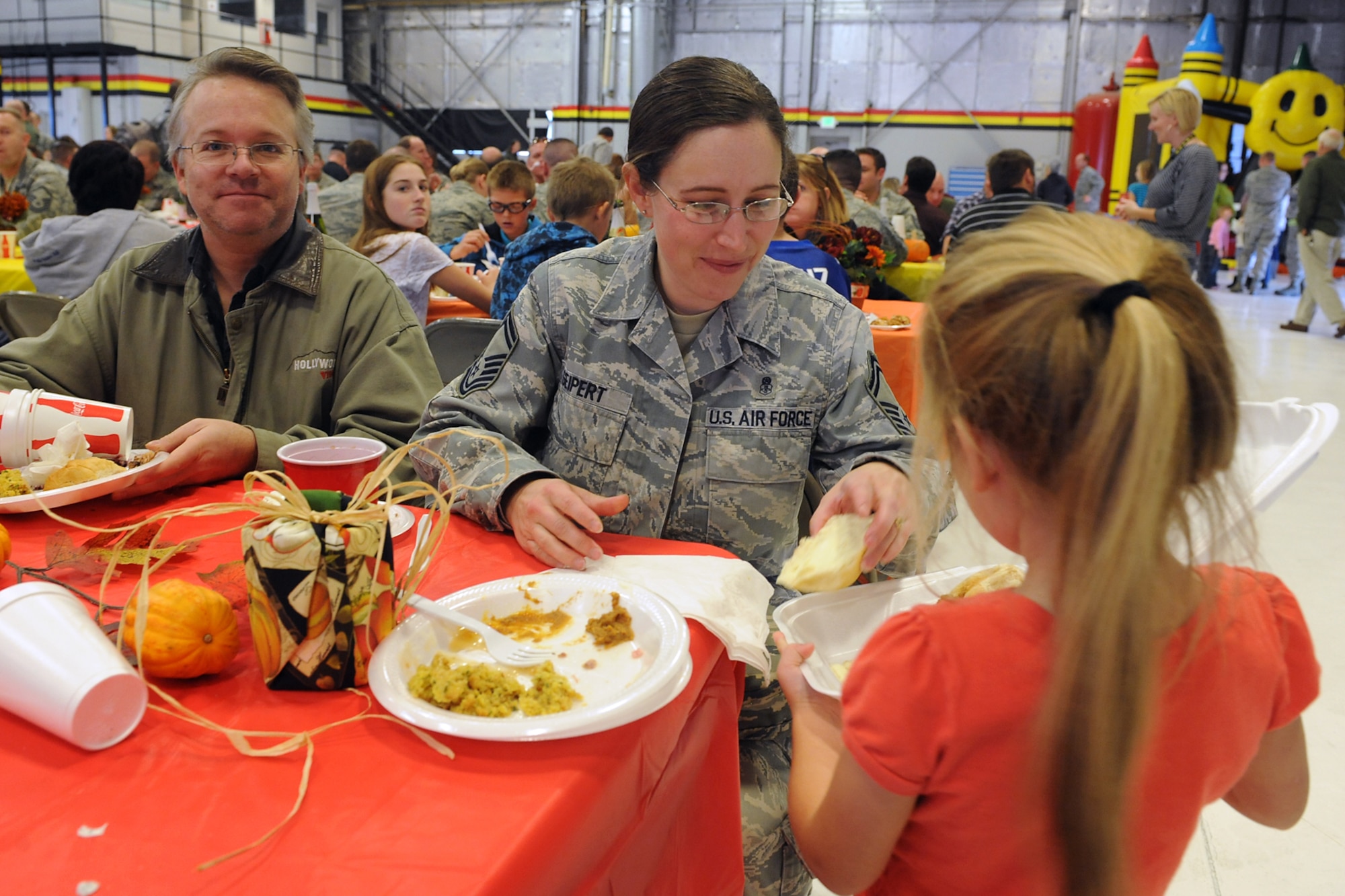 Senior Master Sgt. Cindy Seipert, 419th Medical Squadron, shares leftovers with her six-year-old daughter, Mary. Reservists and their families joined their active duty for a holiday celebration here today. (U.S. Air Force photo/Alex Lloyd)