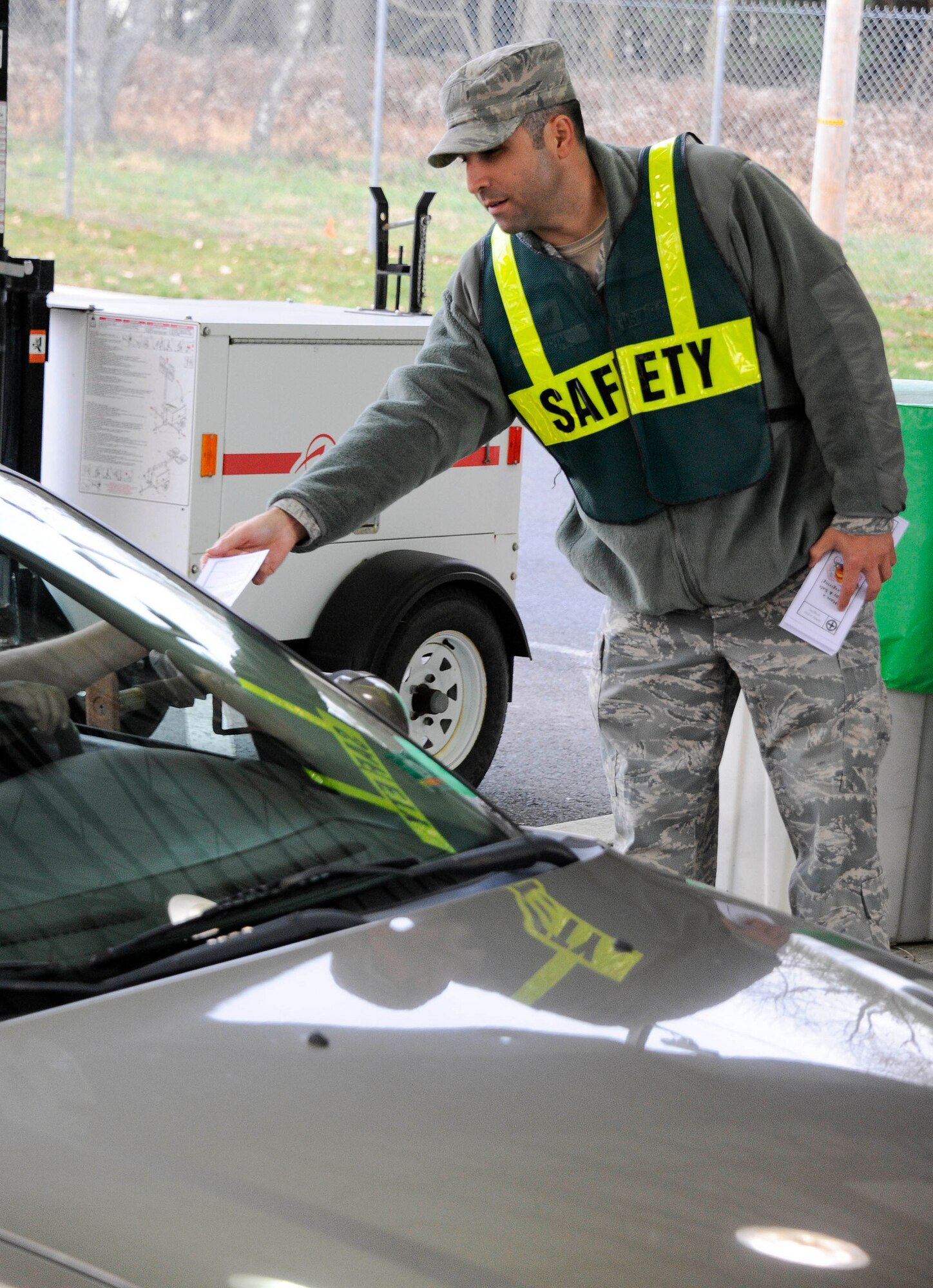 Tech. Sgt. Jacob Tarin, Joint Base McGuire-Dix-Lakehurst Safety Office, greets JB MDL community members Nov. 20, 2012, as they exit the Pemberton Gate. The base’s senior leaders, along with base safety personnel, wished all members a safe and happy holiday. (U.S Air Force photo by Airman 1st Class Ryan Throneberry/Released)