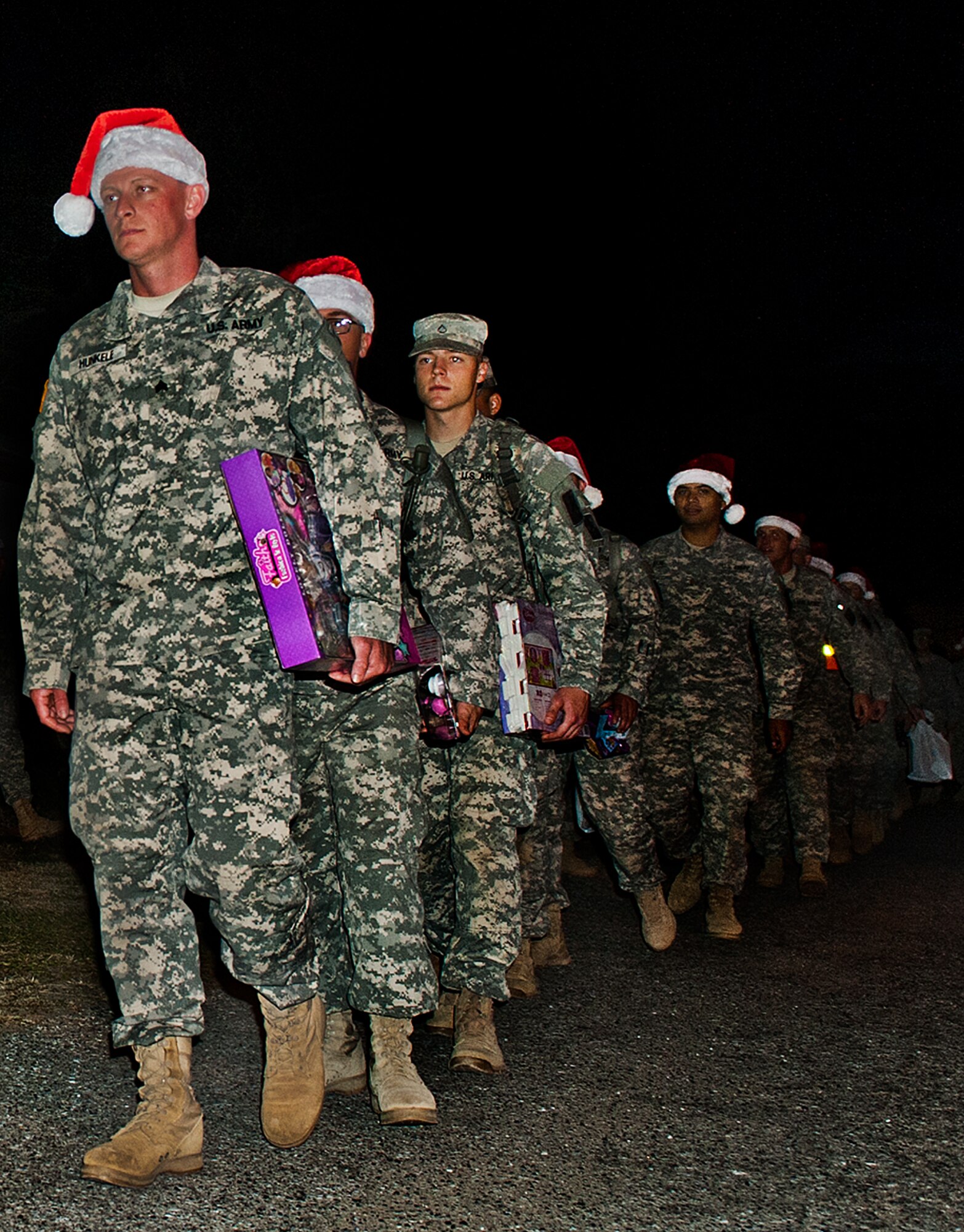 More than 300 Soldiers from the Army Detachment of the Naval School Explosive Ordnance Disposal march toward the Airman’s Attic on Eglin Air Force Base, Fla. Nov. 20. The highlight of this formation was an opportunity to deliver toys, costing no more than $15, as holiday donations for active-military families Nov. 29th. The detachment belongs to a Navy-managed command, jointly staffed by Army, Navy, Air Force, and Marine Corps personnel schoolhouse for future military EOD technicians (U.S. Air Force photo/Randy Gon)