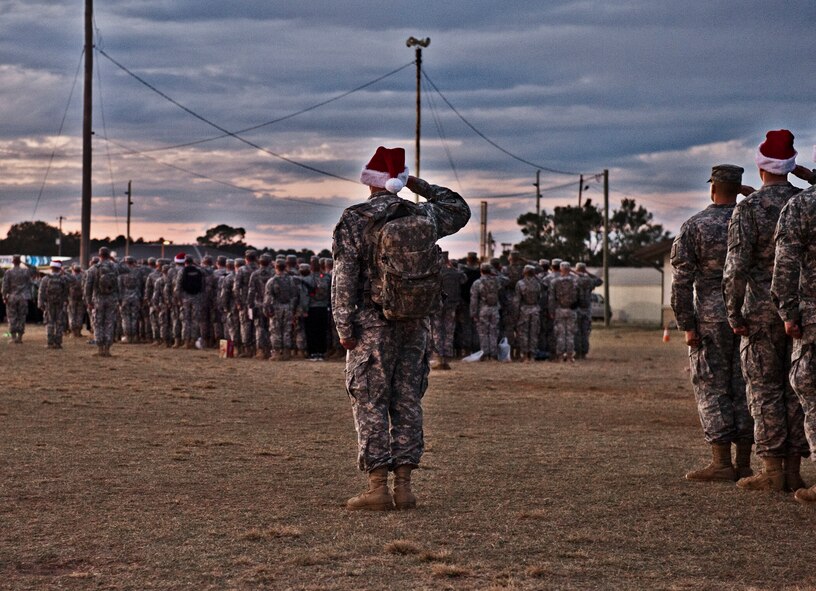 More than 300 from the Army Detachment of the Naval School Explosive Ordnance Disposal salute during the National Anthem before marching in formation at Eglin Air Force Base, Fla. Nov. 20. The highlight of this march was an opportunity to deliver toys, costing no more than $15, as holiday donations for active-military families Nov. 29th. The detachment belongs to a Navy-managed command, jointly staffed by Army, Navy, Air Force, and Marine Corps personnel schoolhouse for future military EOD technicians (U.S. Air Force photo/Randy Gon)
