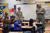 Staff Sgt. John Reuter, a member of the 115th Fighter Wing’s Security Forces Squadron, answers questions from a student at Clarendon Avenue Elementary School in Mukwonagon, Wis., November 20, 2012.  Reuter, along with Spc. Kasey Jordan, a Soldier with the 457th Chemical Co., was at the school to talk with the kids and hand out ice cream to reward them for being one of the top-four finishing classes in the school’s Soldier Box drive. (National Guard photo by 2nd. Lt. Stephen Montgomery)