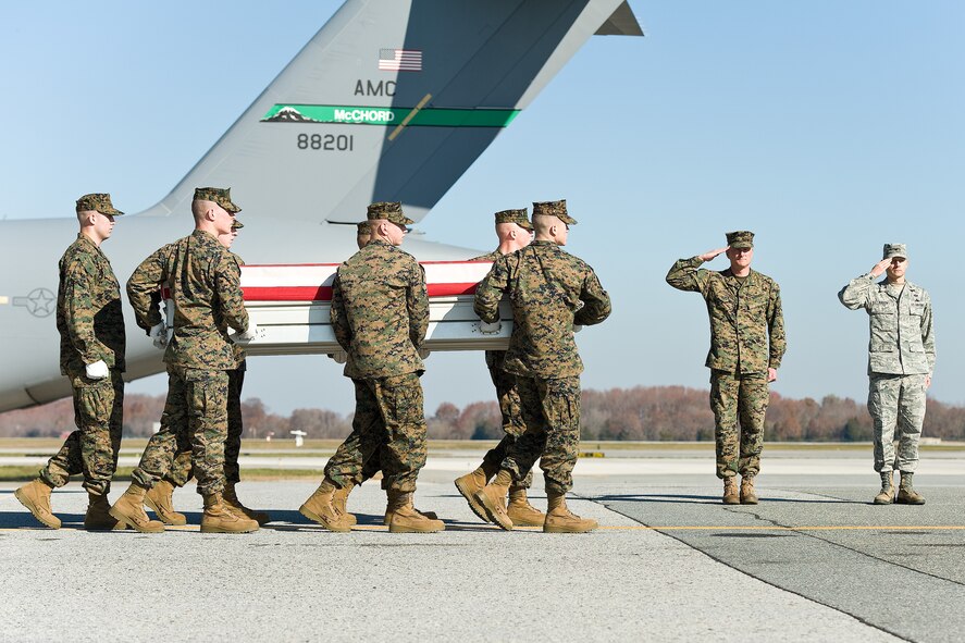 A U.S. Marine Corps carry team transfers the remains of Marine Lance Cpl. Dale W. Means, of Jordan, Minn., at Dover Air Force Base, Del., Nov. 21, 2012. Means was assigned to Combat Logistics Battalion 2, 2nd Marine Logistics Group, II Marine Expeditionary Force, Camp Lejeune, N.C. (U.S. Air Force photo/Roland Balik)