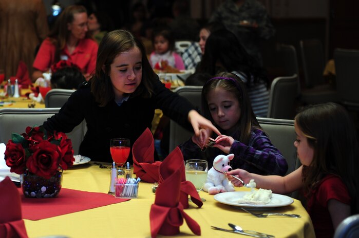 Alexis, Carissa and Aliyah Steinbrecher, daughters of Melissa Steinbrecher and U.S. Air Force 1st Lt. John Steinbrecher, 99th Medical Group intensive care unit nurse, attend the Annual Deployed/Remote Family Thanksgiving Dinner Nov.16, 2012, at Nellis Air Force Base, Nev. The dinner is a way for the units on the instillation to say thank you and show support for Nellis/Creech/Nevada Test and Training Range and sister service families. (U.S. Air Force photo by Staff Sgt. William P. Coleman)  

