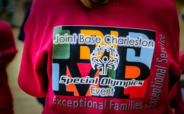 Volunteers wear Joint Base Charleston Exceptional Family Member Program shirts to identify themselves Nov. 17, 2012, during the Special Olympics Event at the JB Charleston – Air Base Fitness Center, S.C. The event provided EFMP members the opportunity to develop physical fitness skills and make connections with other children. (U.S. Air Force photo / Airman 1st Class Tom Brading)