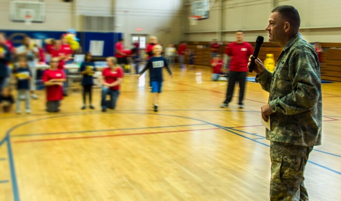 Col. Richard McComb, Joint Base Charleston commander, gives opening comments during the JB Charleston Exceptional Family Member Program’s Special Olympics Event Nov. 17, 2012, at the JB Charleston – Air Base Fitness Center, S.C. EFMP assistance includes on-and-off-base information and referral, parent training, support groups, relocation assistance, financial management and school information. (U.S. Air Force photo / Airman 1st Class Tom Brading)