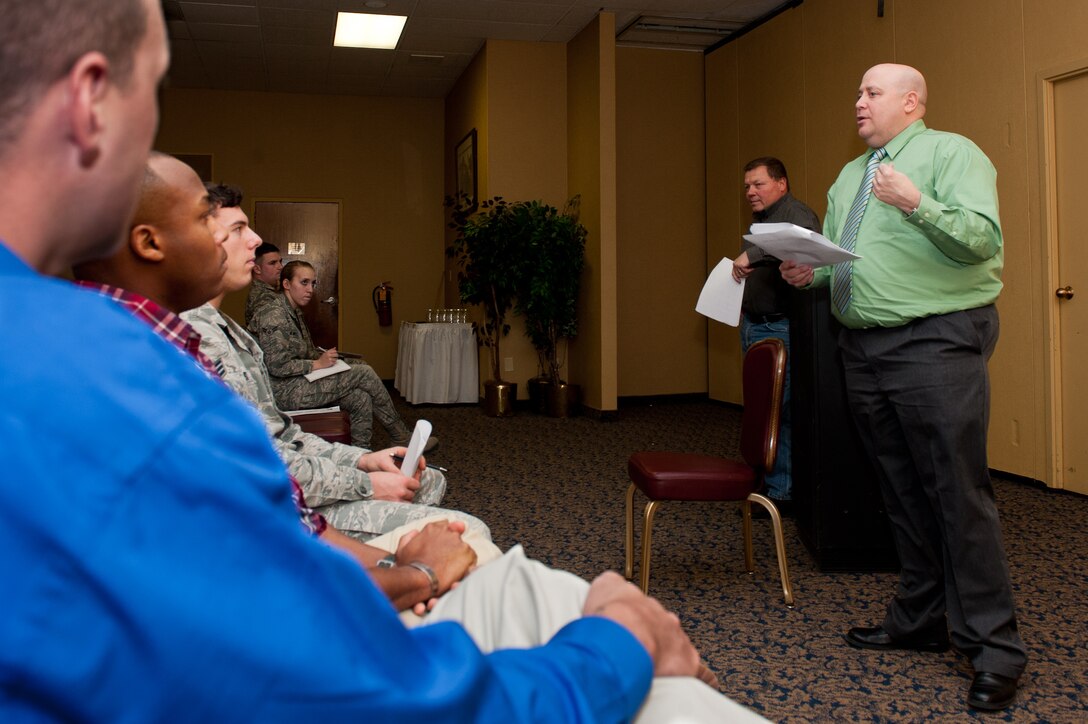 Carlos Moore of National American University and Hugh Watkins of Embry -Riddle Aeronautical University, speak to Airmen about the many educational benefits available to them during an informational seminar on Ellsworth Air Force Base, S. D., Nov. 19, 2012. Airmen were invited to the seminar, hosted by Group 56, a private organization on Ellsworth, to learn about various aspects of military life including Tricare and medical benefits, educational benefits, legal information, military and family life counselors, and programs offered by the Airman and Family Readiness Center. (U.S. Air Force photo by Airman 1st Class Kate Thornton-Maurer/Released) 