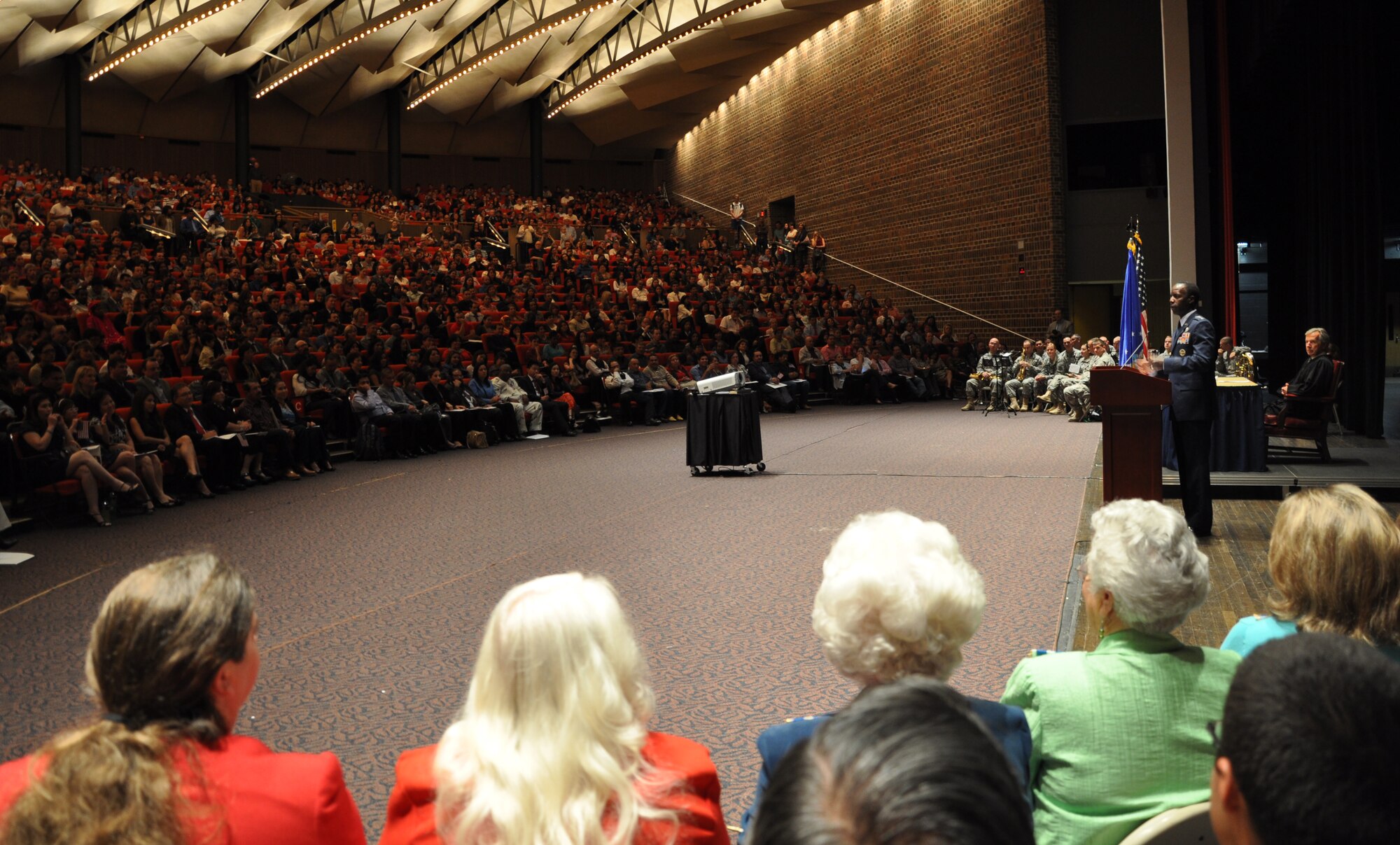 SAN ANTONIO, Texas – Gen. Edward A. Rice Jr., commander of Air Education and Training Command, speaks to immigrants from 87 countries Nov. 20 at a U.S. naturalization and citizenship ceremony at Trinity University’s Laurie Auditorium here. As the guest of honor, General Rice addressed the 885 new citizens to welcome and encourage them to get the most out of the opportunity citizenship can bring. (U.S. Air Force photo/Dianne Moffett)