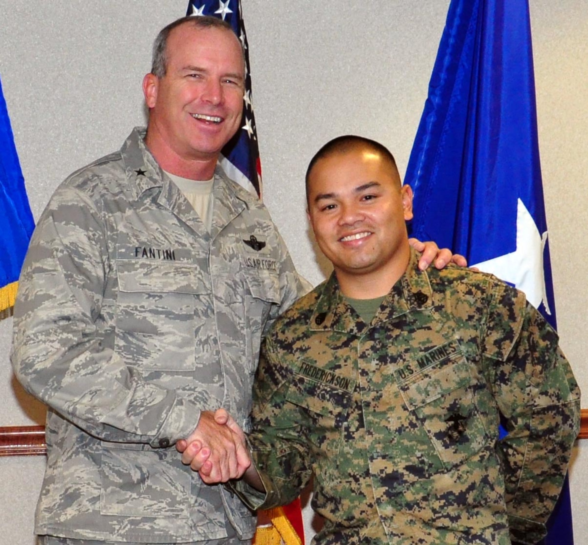 Brig. Gen. Michael Fantini, 82nd Training Wing commander, congratulates Staff Sgt. Mark Frederickson, 364th Training Squadron, on his selection as the "Commander's Wingman of Choice" for Nov. 19-23, 2012. Frederickson is an Instructor and has been at Sheppard Air Force Base for a little over a year. (US Air Force Photo/Josh Wilson)