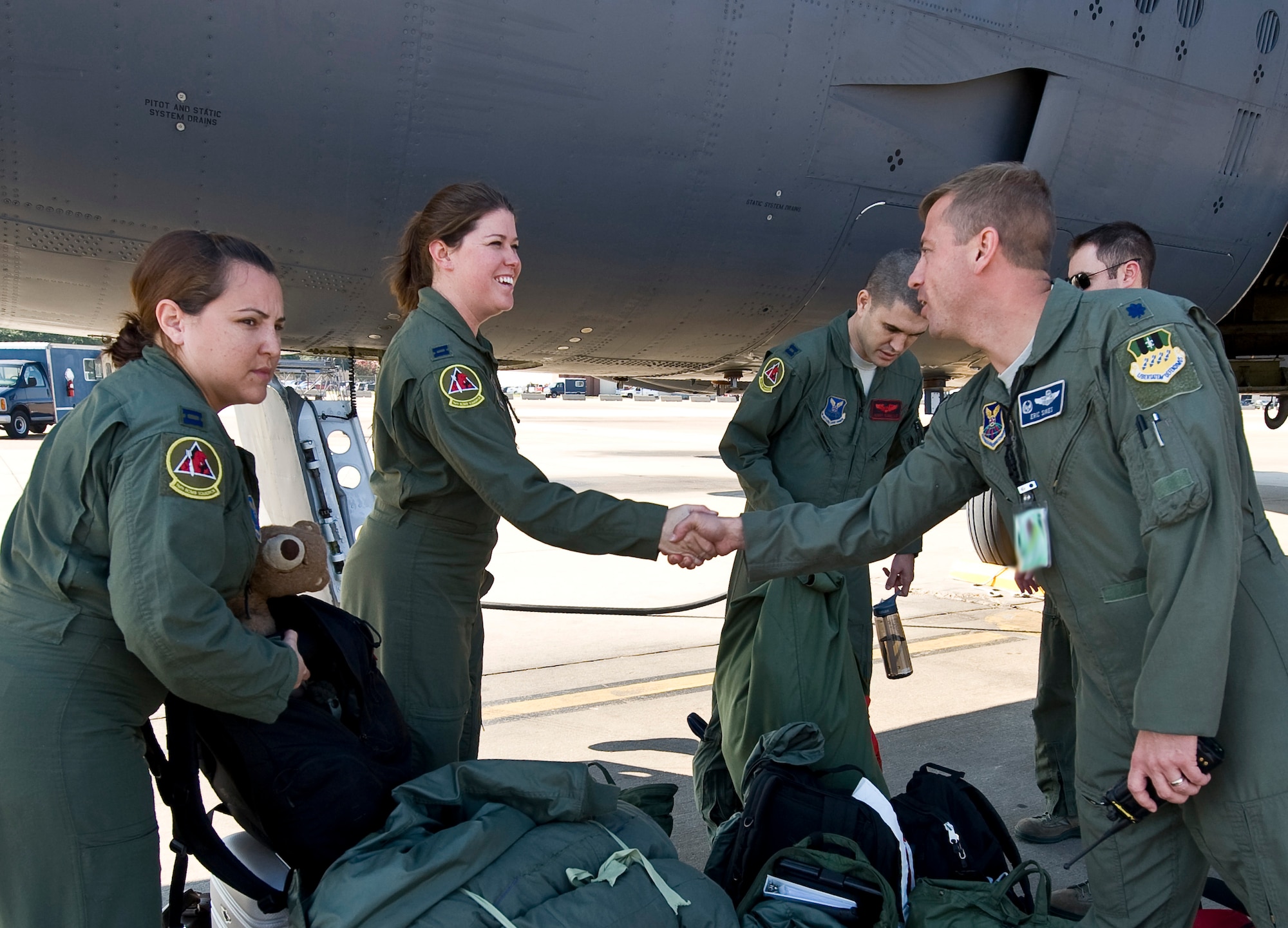 Lt. Col. Eric Sikes, 20th Bomb Squadron commander, greets aircrew members assigned to the 20 BS upon their return to Barksdale Air Force Base, La., Nov. 20. The Airmen are returning from Guam, where they were deployed in support of the continuous bomber presence there. (U.S. Air Force photo/Staff Sgt. Chad Warren)(RELEASED)