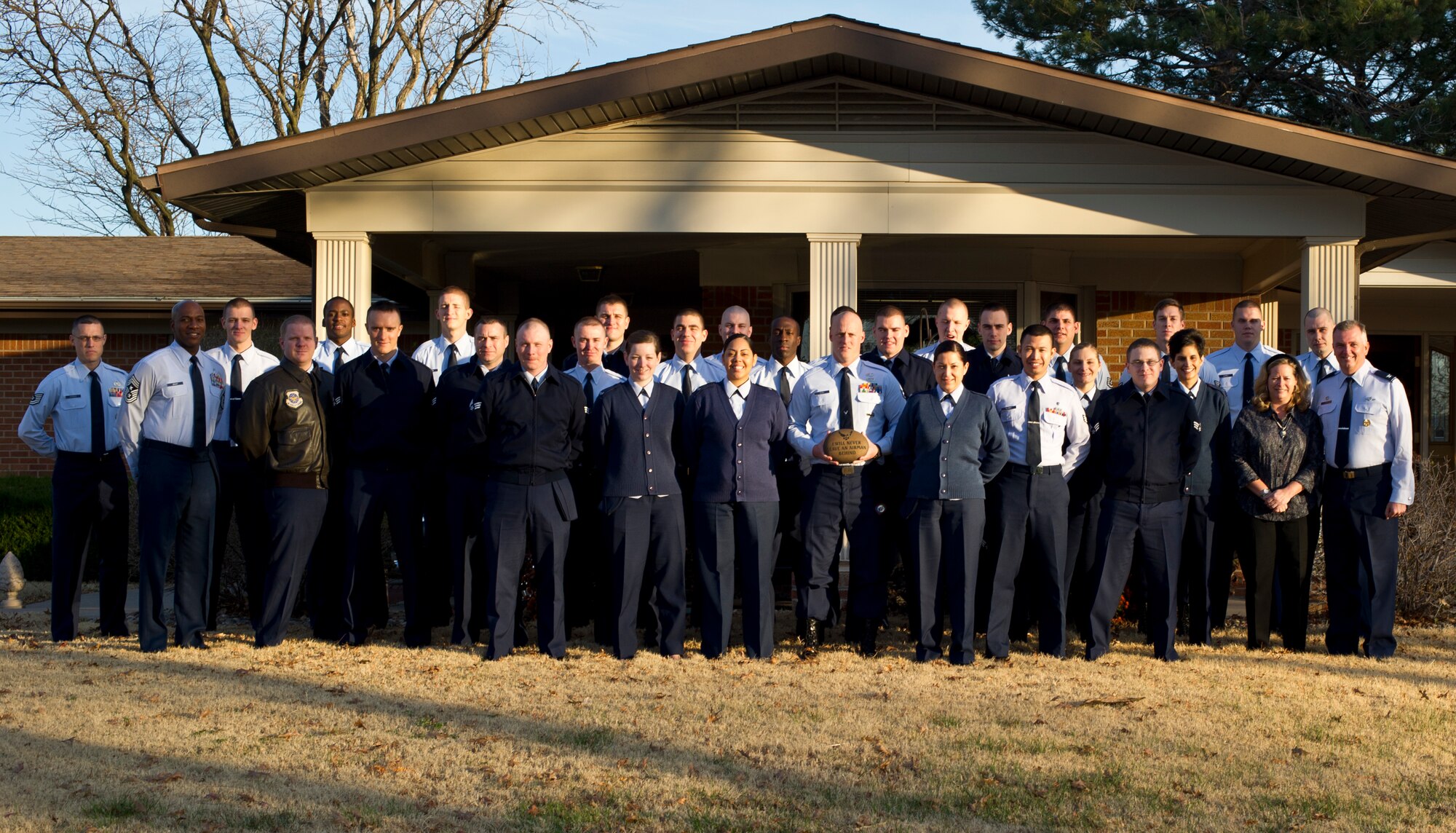 Members of Airman Leadership School pose with Col. Ricky Rupp, 22nd Air Refueling Wing commander, his spouse and Chief Master Sgt. Kaleth Wright, 22nd ARW command chief, Nov. 19, 2012, at McConnell Air Force Base. The base commander hosted approximately 25 students for breakfast and a discussion. (U.S. Air Force photo/Senior Airman Armando A. Schwier-Morales) 