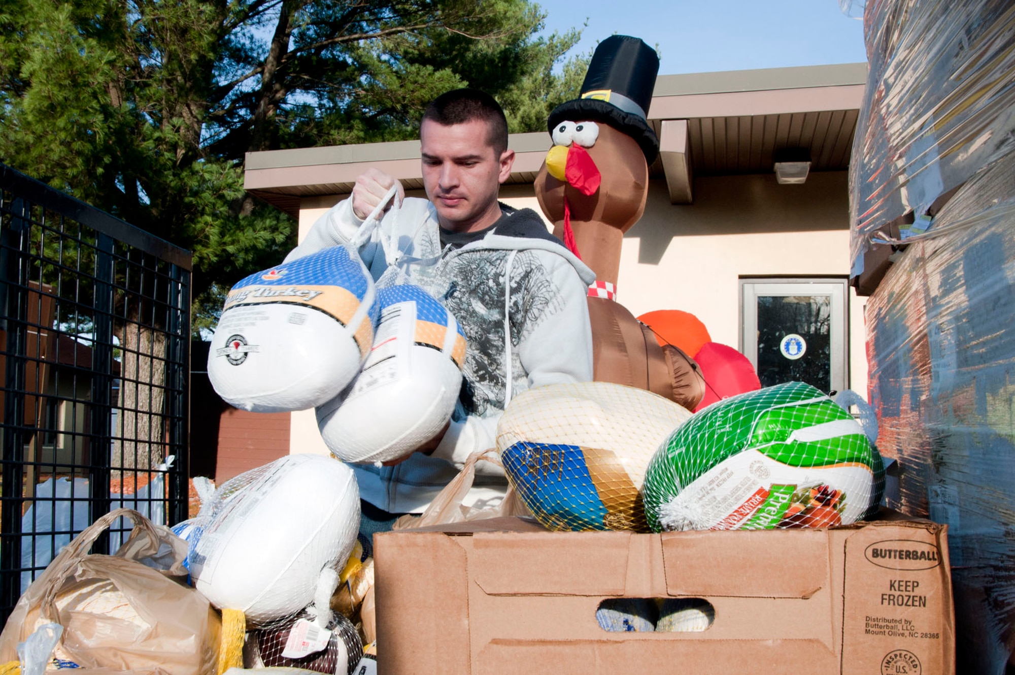 HANSCOM AIR FORCE BASE, Mass. – Airman 1st Class Jason Walker donates five turkeys on behalf of the Patriot Enlisted Association outside the 319th Recruiting Group building as part of the third annual Top Three Turkey Drive Nov. 20. The Top Three collected the turkeys and gave them to Hanscom families that might need one less thing to worry about this holiday season. (U.S. Air Force photo by Mark Wyatt)