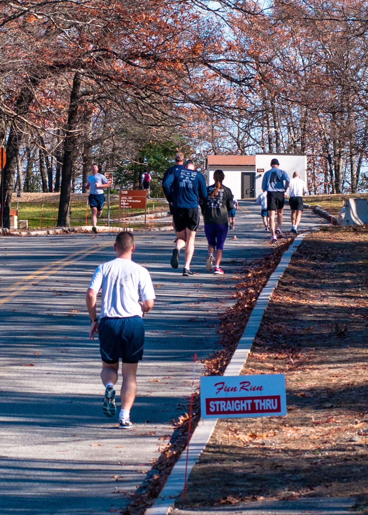 HANSCOM AIR FORCE BASE, Mass. - Runners participate in the Turkey Trot 5K fun run throughout base Nov. 14. Jon Schoenberg came in first place in the male category at a time of 19:58 and Katie Murray placed first in the female category with a run time of 30:34. (U.S. Air Force photo by Rick Berry)