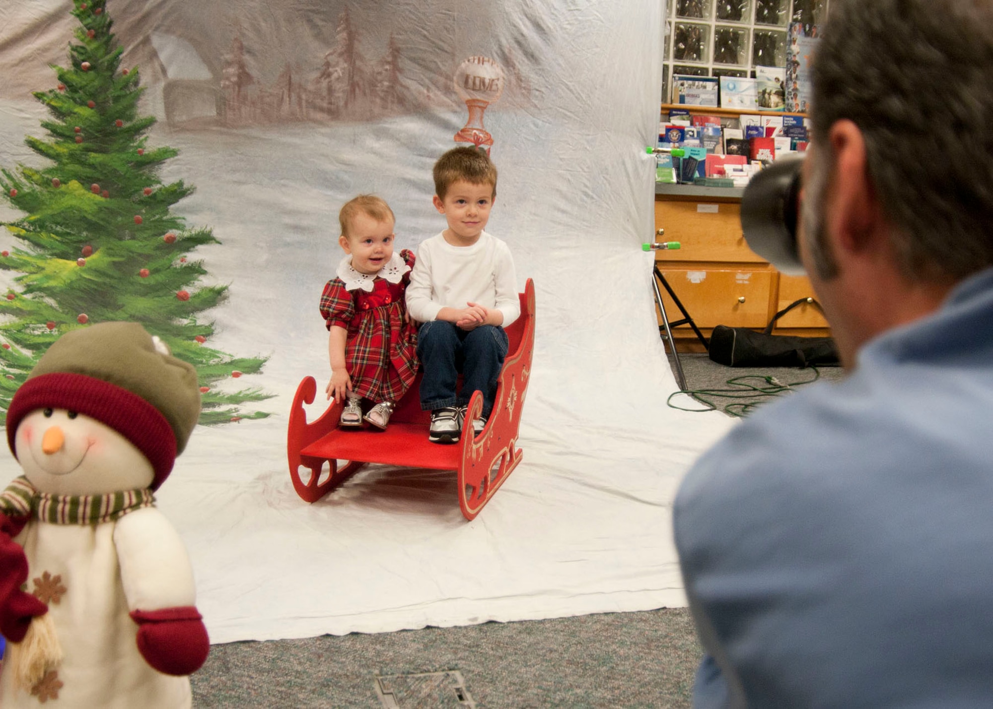 HANSCOM AIR FORCE BASE, Mass. -- Matthew and Julia Haile pose for portraits during Hearts Apart at the Airman and Family Readiness Center Nov. 14. John Schreiber Photography volunteered his services during the event to take portraits of families who have a loved one deployed during the holidays. (U.S. Air Force photo by Mark Wyatt)
