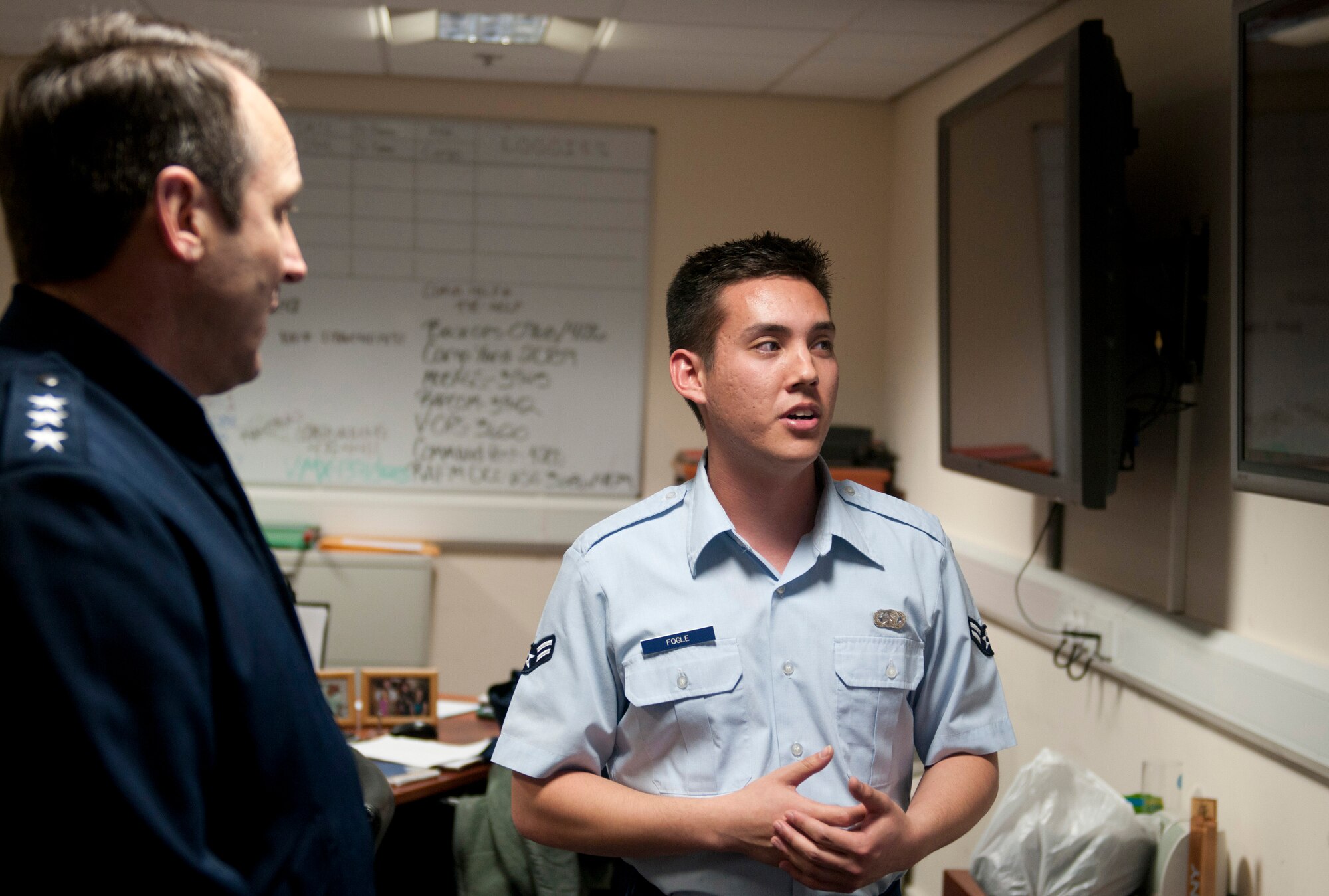 ROYAL AIR FORCE LAKENHEATH, England - Airman 1st Class Andrew Fogle, 48th Logistics Readiness Squadron logistics planner and native of Colorado Spring, Colo., speaks with  Lt. Gen. Noel T. Jones, U.S. Air Forces in Europe vice commander, Ramstein Air Base, Germany, about logistic capabilities Nov. 19, 2012. During the visit, Jones received a wing mission brief and visited the installation deployment readiness center, 48th Medical Group, 48th Munitions Squadron and 56th Rescue Squadron to familiarize himself with the 48th Fighter Wing members and mission. (U.S. Air Force photo by Staff Sgt. Stephen Linch)