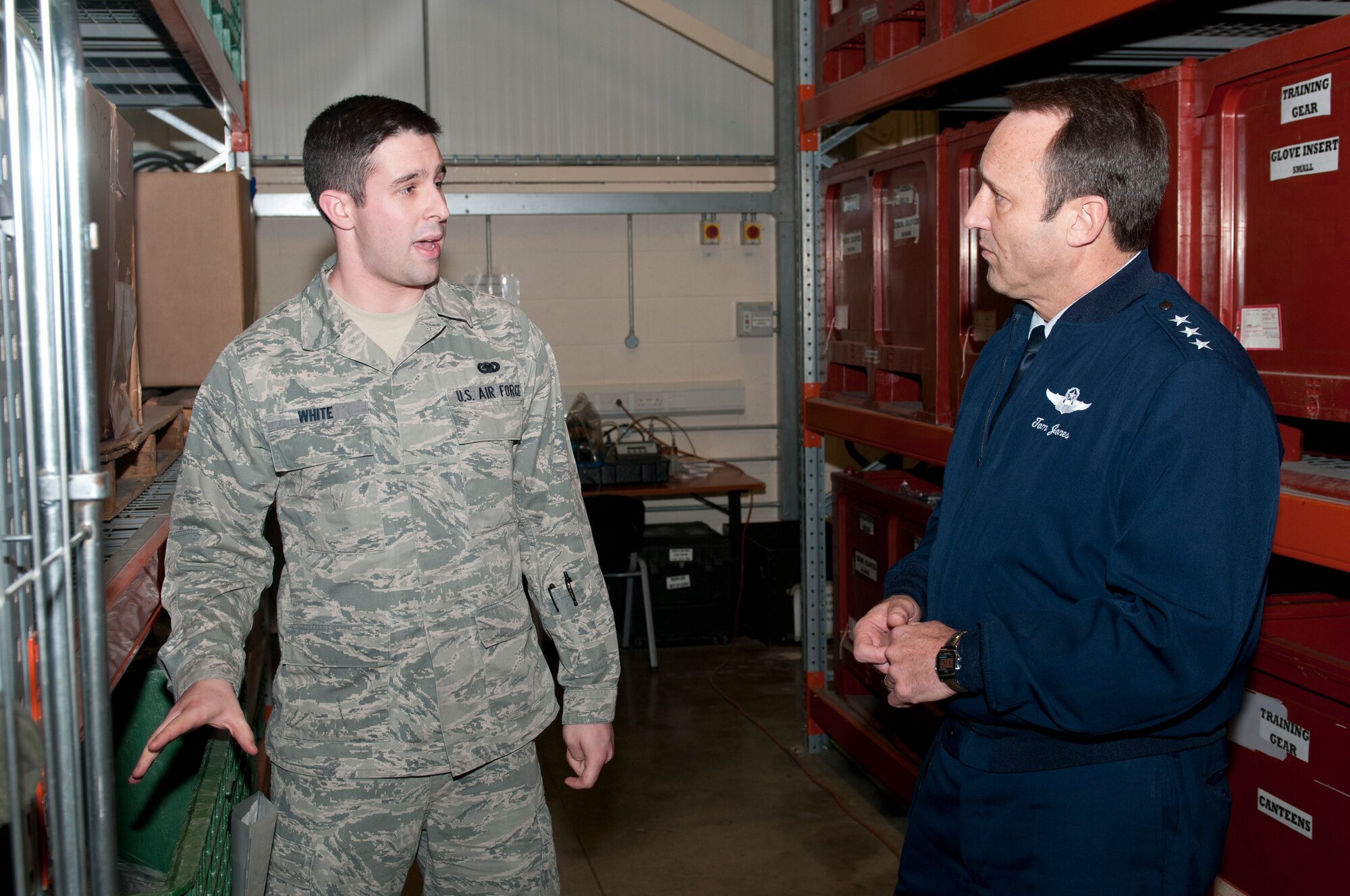 ROYAL AIR FORCE LAKENHEATH, England - Airman 1st Class Alexander White, 48th Logistics Readiness Squadron individual protective equipment clerk and native of Castle Rock, Colo., speaks with Lt. Gen. Noel T. Jones, U.S. Air Forces in Europe vice commander, Ramstein Air Base, Germany, about the equipment issuing process Nov. 19, 2012. During the visit, Jones received a wing mission brief and visited the installation deployment readiness center, 48th Medical Group, 48th Munitions Squadron and 56th Rescue Squadron to familiarize himself with the 48th Fighter Wing members and mission. (U.S. Air Force photo by Staff Sgt. Stephen Linch)