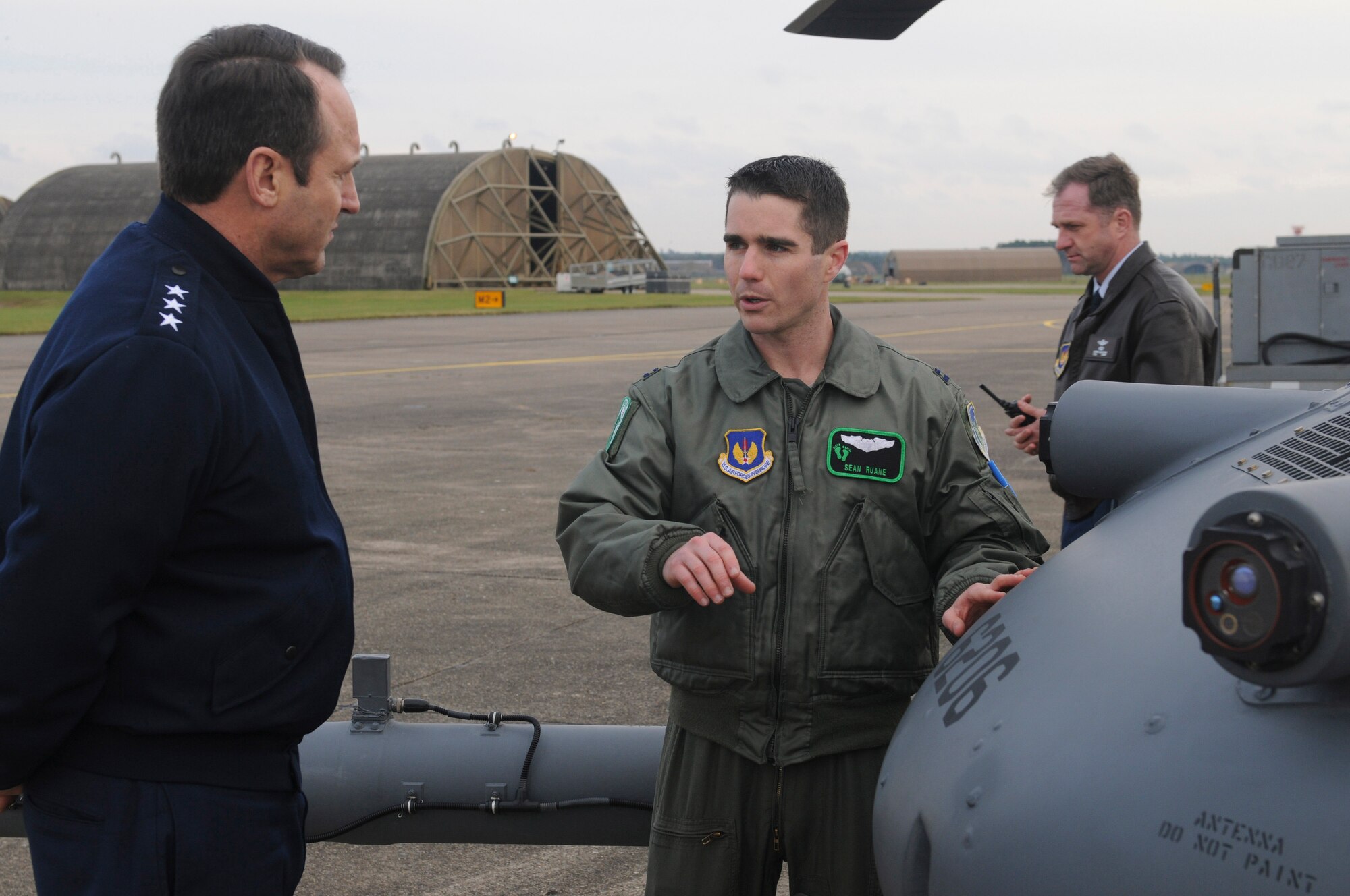ROYAL AIR FORCE LAKENHEATH, England - Capt. Sean Ruane, 56th Rescue Squadron chief of standardization evaluation and native of Pittsburg, Pa., speaks with Lt. Gen. Noel T. Jones, U.S. Air Forces in Europe vice commander, Ramstein Air Base, Germany, about the capabilities of the HH-60G Pave Hawk Nov. 19, 2012. During the visit, Jones received a wing mission brief and visited the installation deployment readiness center, 48th Medical Group, 48th Munitions Squadron and 56th RQS to familiarize himself with the 48th Fighter Wing members and mission. (U.S. Air Force photo by Staff Sgt. Stephen Linch)