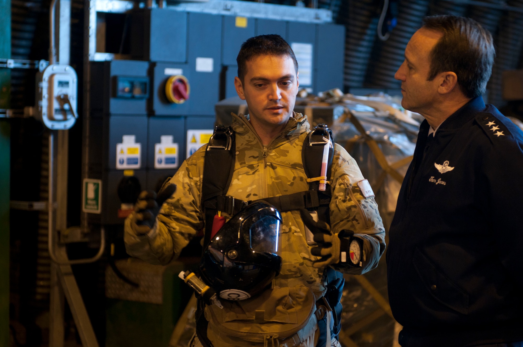 ROYAL AIR FORCE LAKENHEATH, England - Capt. William Chase, 56th Rescue Squadron combat rescue officer, guardian angel flight commander and native of South Pasadena, Calif., gives a mission overview to Lt. Gen. Noel T. Jones, U.S. Air Forces in Europe vice commander, Ramstein Air Base, Germany, Nov. 19, 2012. During the visit, Jones received a wing mission brief and visited the installation deployment readiness center, 48th Medical Group, 48th Munitions Squadron and 56th RQS to familiarize himself with the 48th Fighter Wing members and mission. (U.S. Air Force photo by Staff Sgt. Stephen Linch)