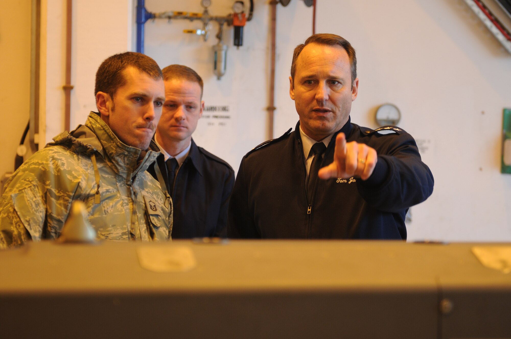ROYAL AIR FORCE LAKENHEATH, England - Lt. Gen. Noel T. Jones, U.S. Air Forces in Europe vice commander, Ramstein Air Base, Germany, talks about munitions capabilities with Master Sgt. Jeremy Bennett, 48th Munitions Squadron conventional maintenance section chief and native of Chattanooga, Tenn., during a walk-through of 48th MUNS Nov. 19, 2012. During the visit, Jones received a wing mission brief and visited the installation deployment readiness center, 48th Medical Group, 48th Munitions Squadron and 56th RQS to familiarize himself with the 48th Fighter Wing members and mission. (U.S. Air Force photo by Staff Sgt. Stephen Linch)