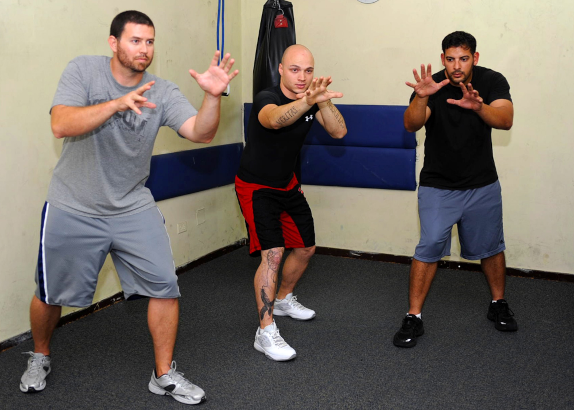 Staff Sgt. Devon Edwards, 728th Air Mobility Squadron crew chief, demonstrates a combat ready stance during class at the Incirlik Fitness Center Nov. 7, 2012, at Incirlik Air Base, Turkey. Edwards is a certified Personal Defense Readiness instructor who teaches the Spontaneous Protection Enabling Accelerated Response System. (U.S. Air Force photo by Staff Sgt. Veuril Mcdavid/Released)