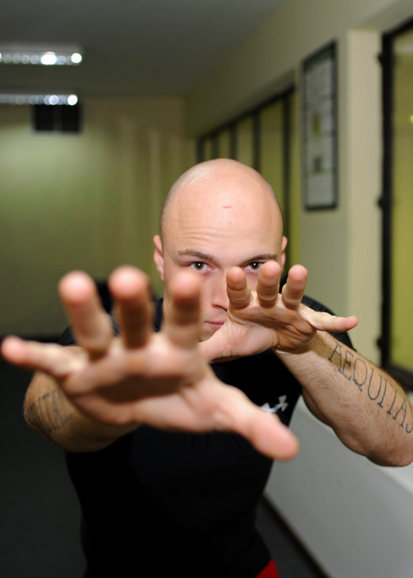 Staff Sgt. Devon Edwards, 728th Air Mobility Squadron crew chief, stands in a combat ready stance Nov. 7, 2012, at Incirlik Air Base, Turkey. Edwards is a certified Blauer Tactical System instructor who teaches the Spontaneous Protection Enabling Accelerated Response System. (U.S. Air Force photo by Staff Sgt. Veuril Mcdavid/Released)