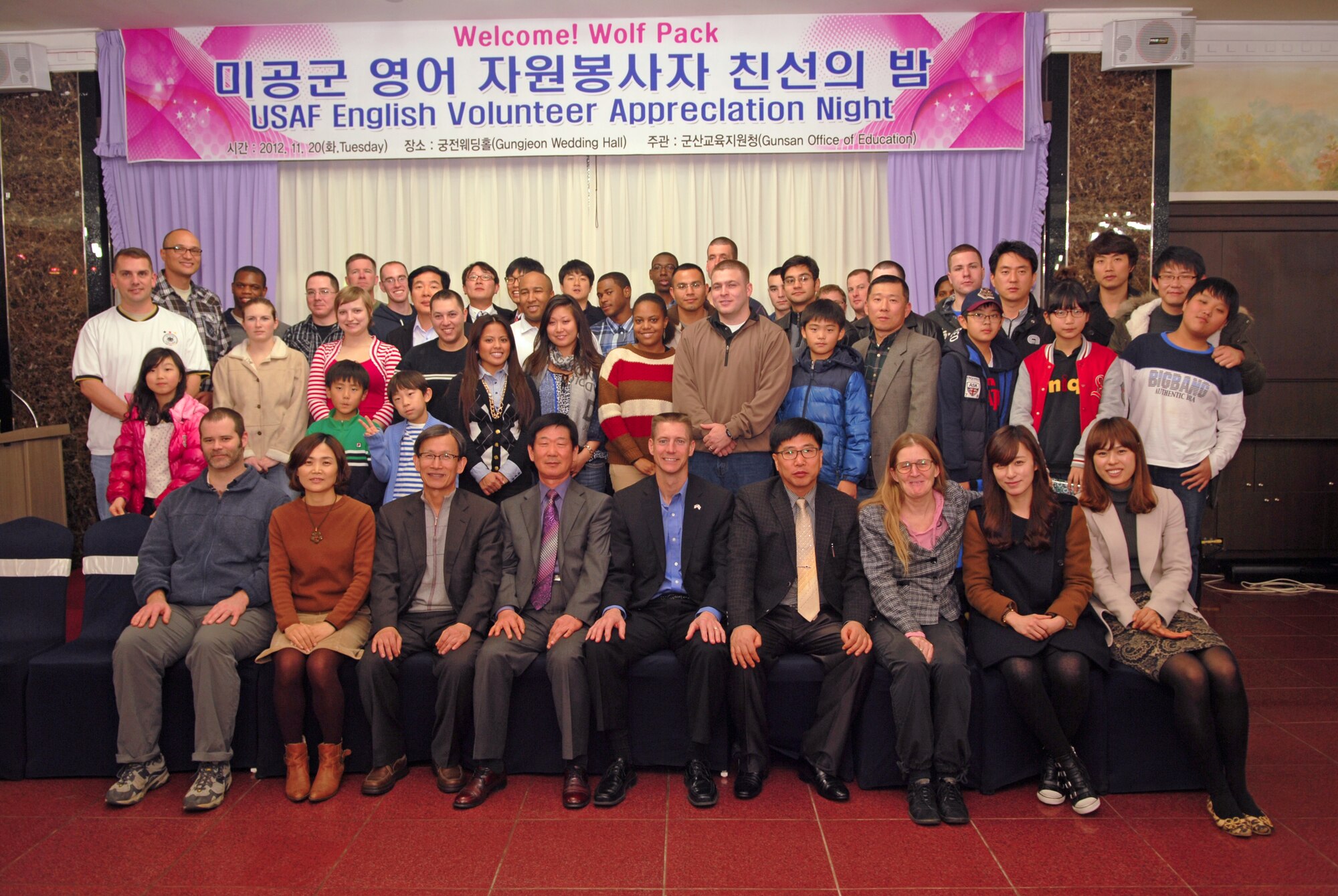 Local elementary and middle school students and teachers honor 8th Fighter Wing, Kunsan Air Base, Republic of Korea volunteers during an appreciation dinner Nov. 20, 2012 in Gunsan City.  Fifty Wolf Pack volunteers extended their English skills to more than 30 local schools. (US Air Force photo/ Staff Sgt. Tong Duong)