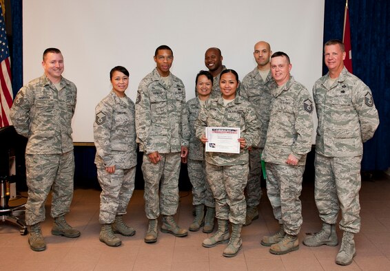 Staff Sgt. Nerynielle Canteen, 39th Medical Support Squadron, receives the Unsung Hero Award from the Incirlik Top 3 organization Nov. 20, 2012, at Incirlik Air Base, Turkey. The Top 3 presents the Unsung Hero Award monthly to an Airman who demonstrates superior job performance and exceptional leadership. (U.S. Air Force photo by Senior Airman Clayton Lenhardt/Released)