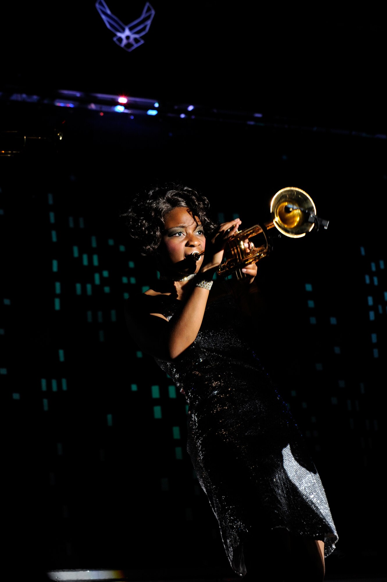 Airman 1st Class Jessica Pitts, Tops in Blues trumpet player performs in the base theater on Kunsan Air Base, Republic of Korea, Nov. 20, 2012. The team consists of 35 Airmen from different career fields from all over the Air Force. Pitts is a cyber systems operations apprentice from the 606th Air Control Squadron Spangdahlem AB, Germany. (U.S. Air Force photo/Senior Airman Marcus Morris)
