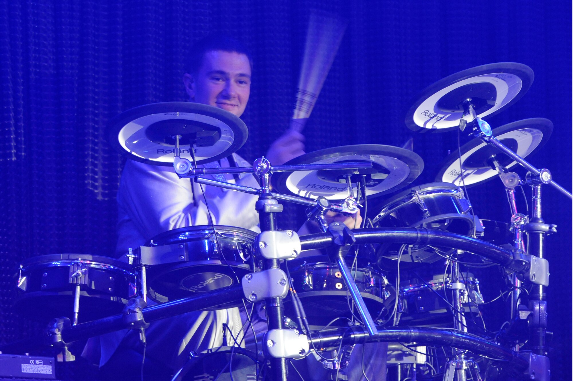 Tech. Sgt. Joshua Tarrant , drummer for Tops in Blue performs during their tour entitled “Listen” in the base theater on Kunsan Air Base, Republic of Korea, Nov. 20, 2012. To be in Tops in Blue, members had to compete in a multilevel competition in order to be selected to go on a one year permissive temporary duty. Tarrant is a space systems operations craftsman from the 460th Operations Group, Detatchment 1 Buckley AFB, CO. (U.S. Air Force photo/Senior Airman Marcus Morris)