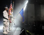 Kunsan honor guard Airmen post the colors for the national anthem during Tops in Blue performance at the base theater on Kunsan Air Base, Republic of Korea, Nov. 20, 2012. Tops in Blue serves as an expeditionary entertainment unit to provide quality entertainment from within Air Force resources for the Air Force family, with priority to Air Force personnel stationed worldwide at remote and deployed locations.
 (U.S. Air Force photo/Senior Airman Marcus Morris)
