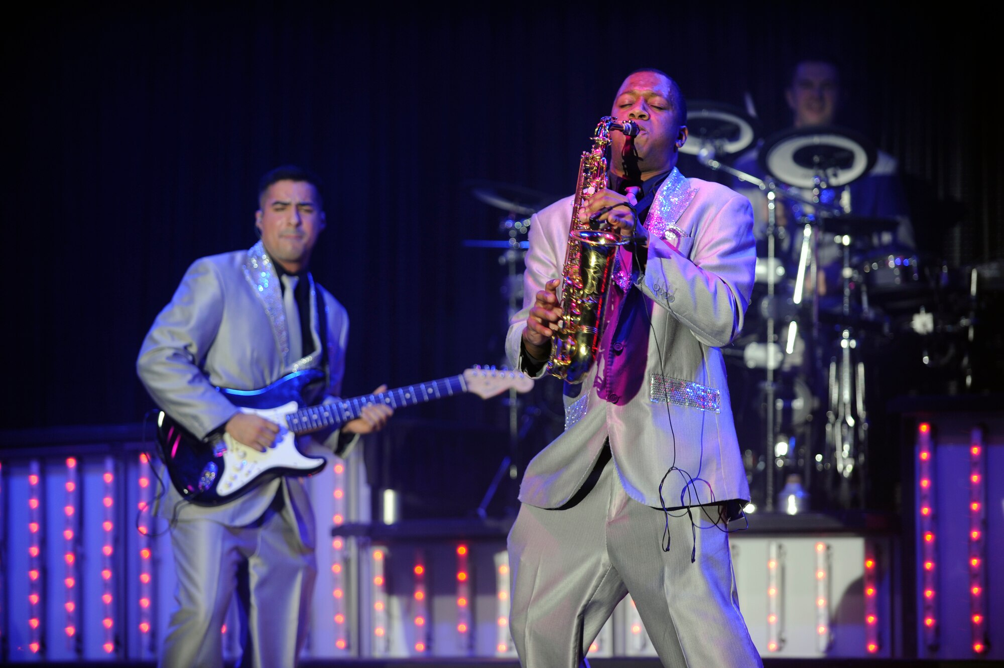 Airman 1st Class Wynton Warren plays a jazz piece on his alto saxophone alongside electric guitarist Senior Airman Kenneth Del Valle Ruiz during a Tops in Blue performance Nov. 20, 2012, at Kunsan Air Base, Republic of Korea. This year’s world tour featured music from many popular artists including Maroon 5, the Doobie Brothers and the Zac Brown Band. (U.S. Air Force photo/Senior Airman Brigitte N. Brantley)