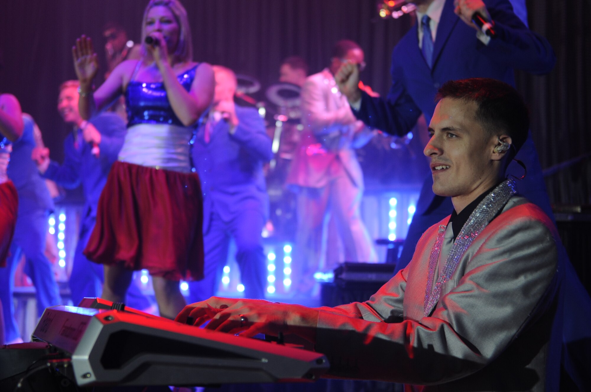 Airman 1st Class Alexander Allred, Tops in Blue member, keeps the crowd entertained on the keyboard during a show at Kunsan Air Base, Republic of Korea, Nov. 20, 2012. This year’s theme, “Listen!,” encouraged the audience to listen to the music of life through the sounds they hear every day. Allred is a knowledge operations management journeyman from the 614th Air and Space Operations Center at Vandenberg Air Force Base, Calif. (U.S. Air Force photo/Senior Airman Brigitte N. Brantley)