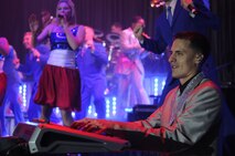 Airman 1st Class Alexander Allred, Tops in Blue member, keeps the crowd entertained on the keyboard during a show at Kunsan Air Base, Republic of Korea, Nov. 20, 2012. This year’s theme, “Listen!,” encouraged the audience to listen to the music of life through the sounds they hear every day. Allred is a knowledge operations management journeyman from the 614th Air and Space Operations Center at Vandenberg Air Force Base, Calif. (U.S. Air Force photo/Senior Airman Brigitte N. Brantley)