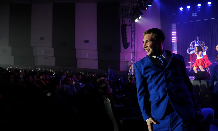 Senior Airman Timothy Stentz, Tops in Blue vocalist, entertains the crowd during a performance Nov. 20, 2012, at Kunsan Air Base, Republic of Korea. During their 10-month tour, Tops in Blue will perform at nearly 130 locations around the world. Stentz is a client systems apprentice from the 375th Communications Squadron at Scott Air Force Base, Ill. (U.S. Air Force photo/Senior Airman Brigitte N. Brantley)