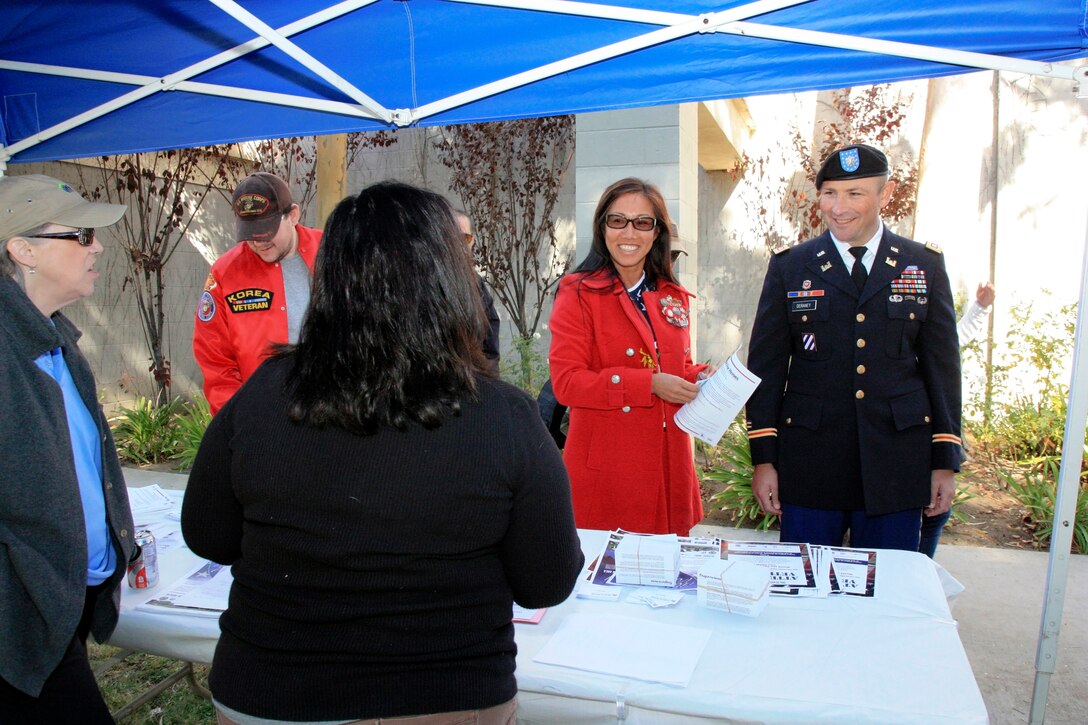 Lt. Col. Alex Deraney, Los Angeles District deputy commander, and his wife Marisa visited the San Fernando–Santa Clarita Valleys’ Habitat for Humanity booth to learn about volunteer opportunities with the Habitat for Heroes program. The Deraneys said they like to keep their family involved in the local community and what better way than helping veterans. They represented the District at the San Fernando Valley Veterans Day parade Nov. 11 in Pacoima, Calif., which also featured a carnival and information booths for community groups and service organizations like the American Legion, Veterans of Foreign Wars and the Veterans Administration providing information for veterans and their families.