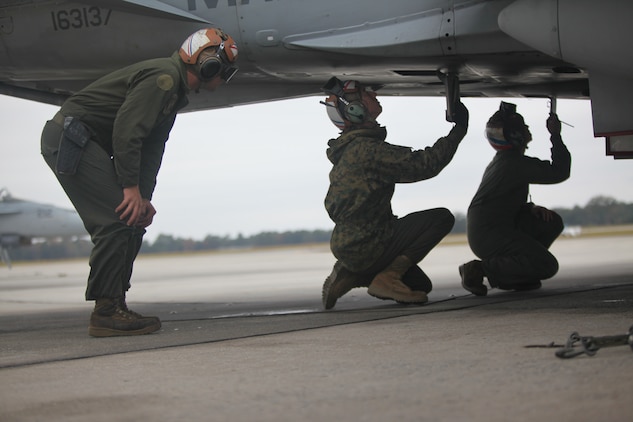 Marine Fighter Attack Squadron 115 maintainers prepare an F/A-18 hornet to complete it 9,000 flight hour aboard Marine Corps Air Station Beaufort, Nov. 13.The squadron's maintainers ensure the aircraft continue flying are responsible for the squadron maintaining the highest state readiness to deploy forward.