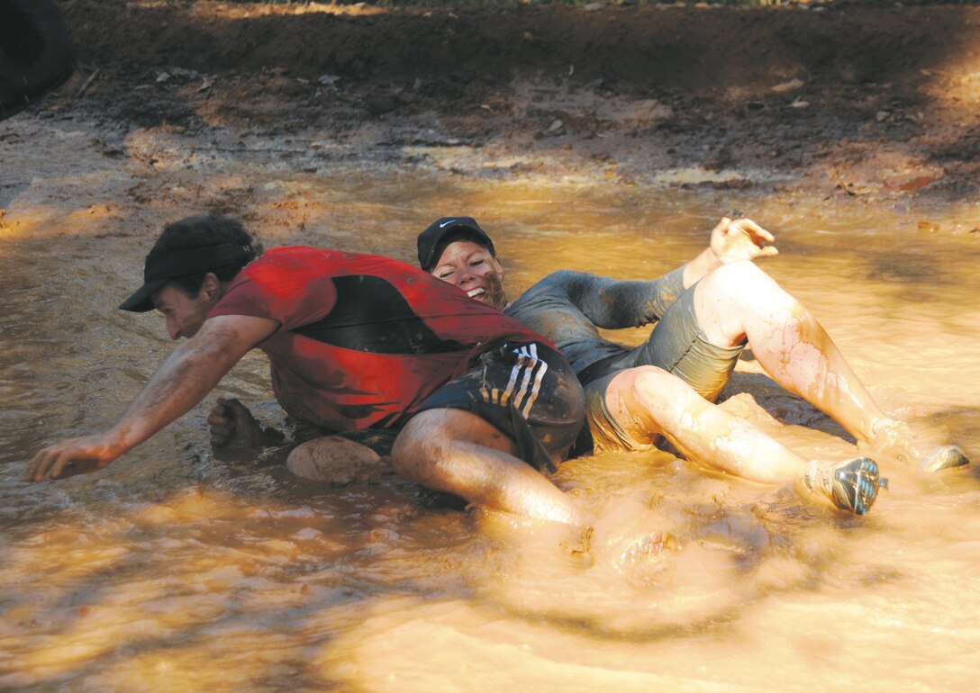 More than 550 people participated in Marine Corps Logistics Base Albany’s first Dirty Devil Dog Mud Run, Nov. 17. Sloshing through canals, jumping barricades and low crawling through mud pits were just a few of the obstacles runners endured. 