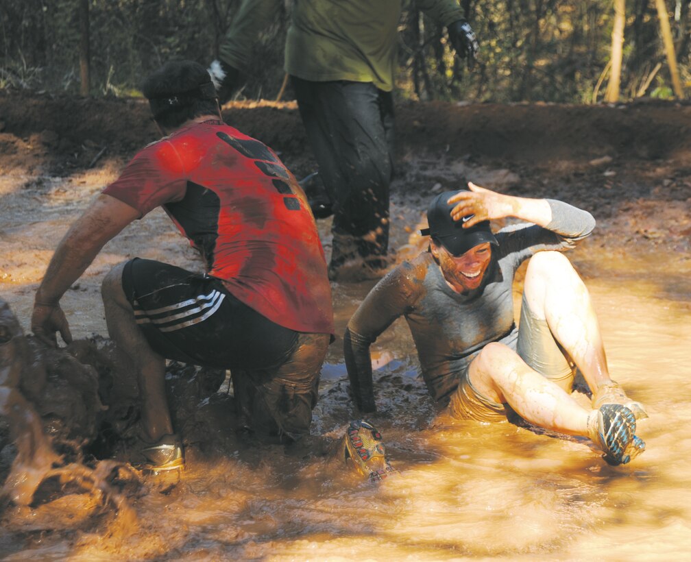 More than 550 people participated in Marine Corps Logistics Base Albany’s first Dirty Devil Dog Mud Run, Nov. 17. Sloshing through canals, jumping barricades and low crawling through mud pits were just a few of the obstacles runners endured. 