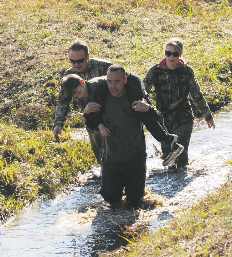 More than 550 people participated in Marine Corps Logistics Base Albany’s first Dirty Devil Dog Mud Run, Nov. 17. Sloshing through canals, jumping barricades and low crawling through mud pits were just a few of the obstacles runners endured. 

