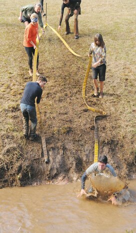 More than 550 people participated in Marine Corps Logistics Base Albany’s first Dirty Devil Dog Mud Run, Nov. 17. Sloshing through canals, jumping barricades and low crawling through mud pits were just a few of the obstacles runners endured. 