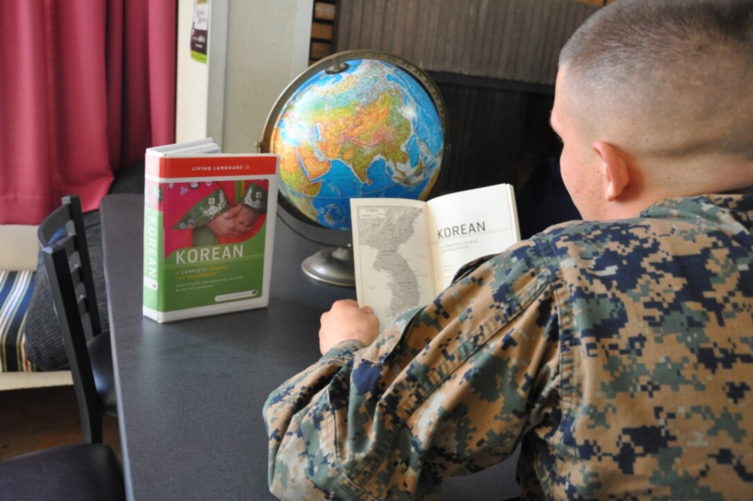 A junior Marine aboard MCLB takes advantage of the resources available at McTureous Hall and looks through a Korean language course. The Korean course is just one of many languages available through the base library.