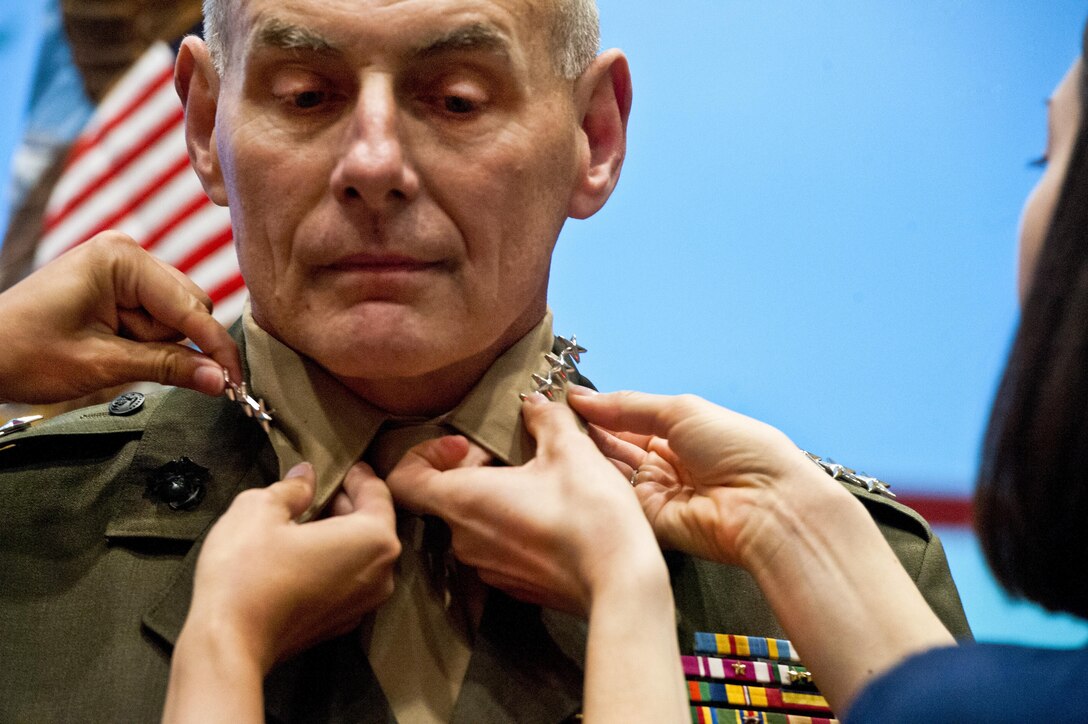 General John Kelly has his fourth star pinned to his collar by his daughter Kate and daughter in law Heather before the Southern Command Change of Command Nov 19, 2012 in Miami, Fl. General Kelly took over for General William Fraser III. DoD photo by Erin A. Kirk-Cuomo (Released)
